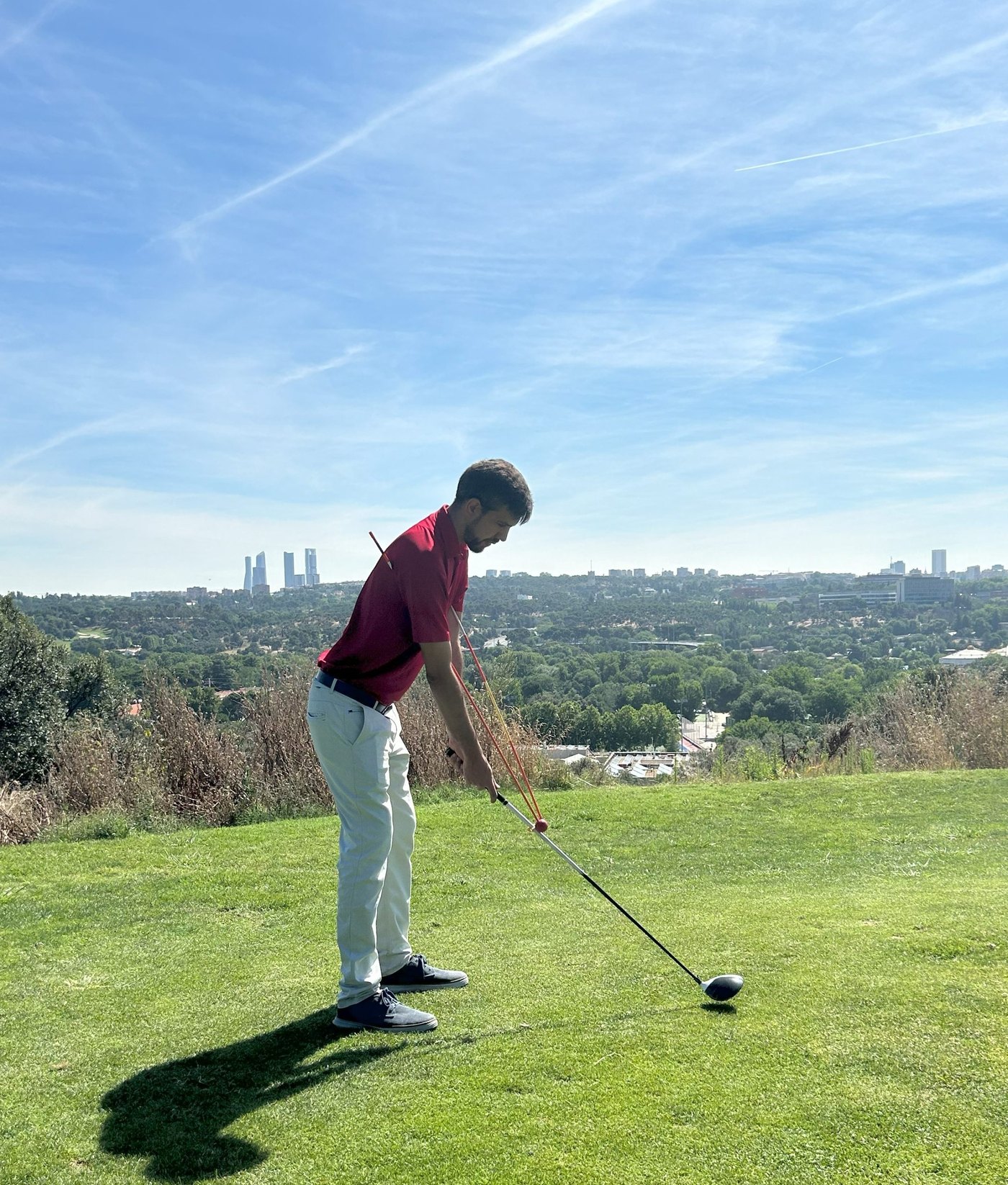 Entrenador de Swing en el campo de prácticas